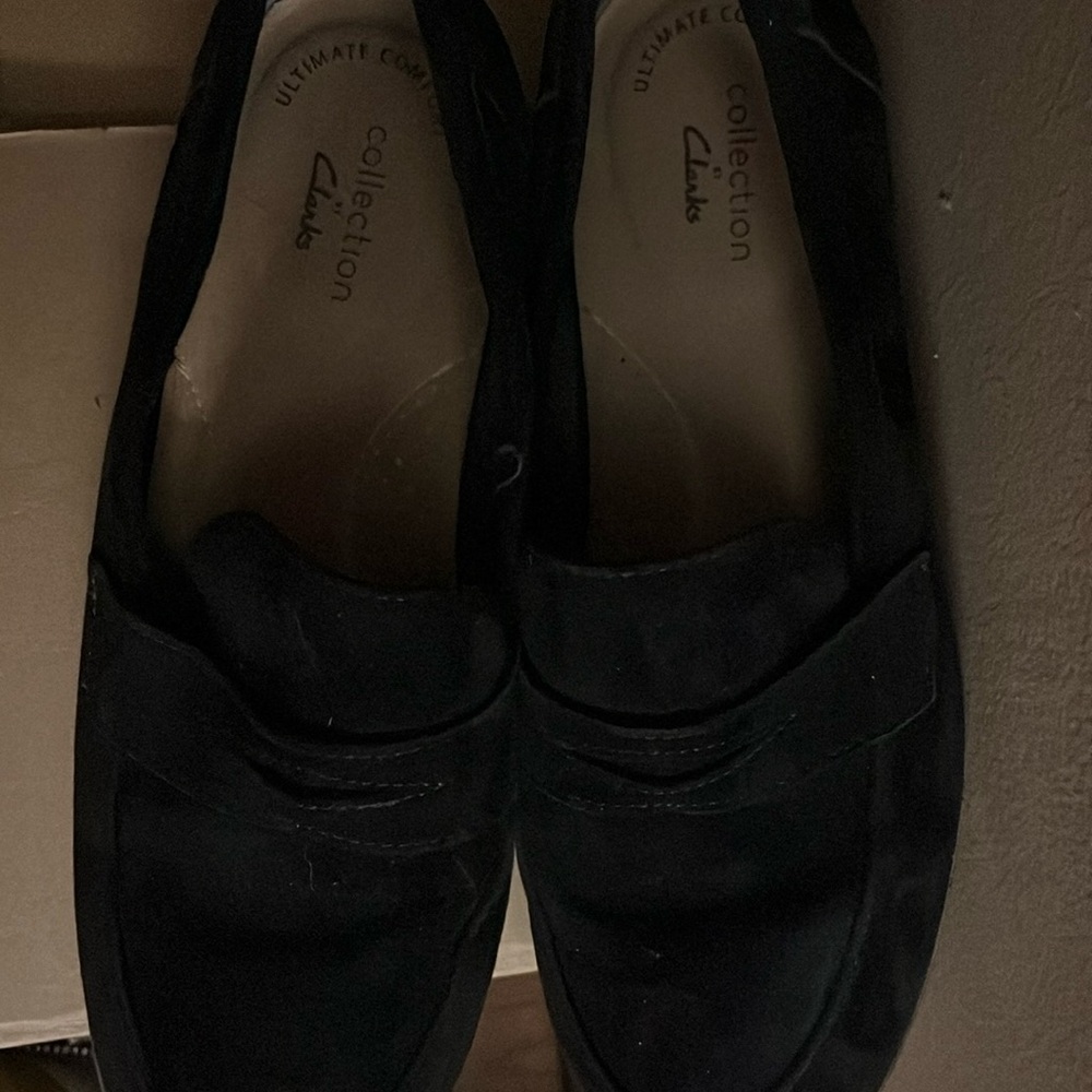 Clark’s black suede loafers